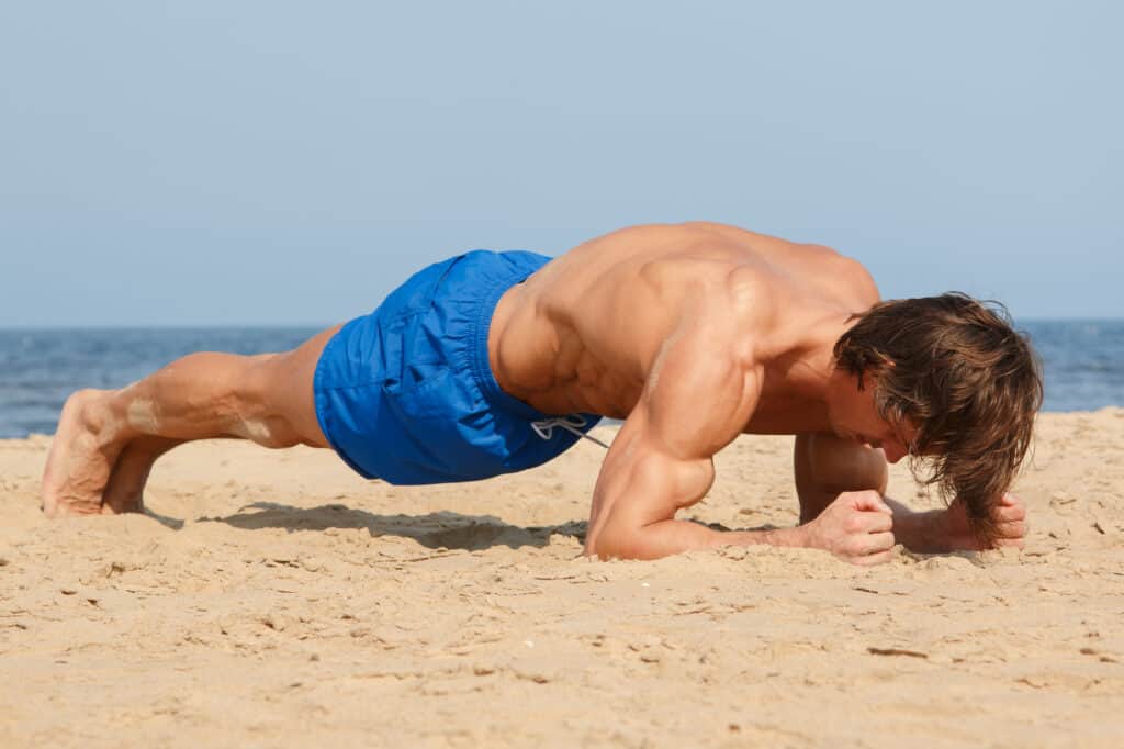 man planking to build core muscles