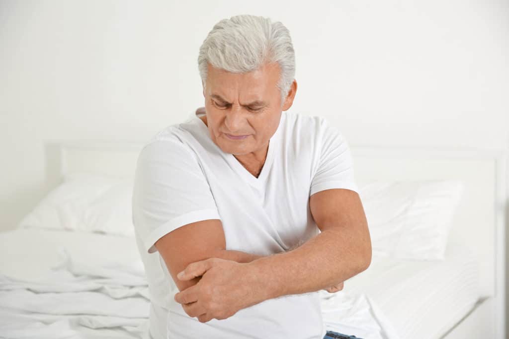 Senior man suffering from arthritis 