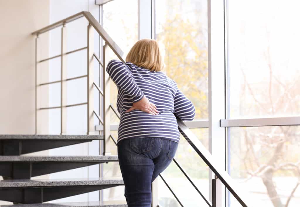 back pain caused by walking upstairs