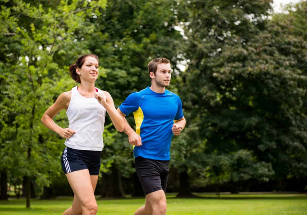 a couple staying active by running