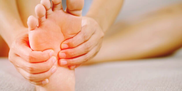 a woman suffering from plantar faciitis