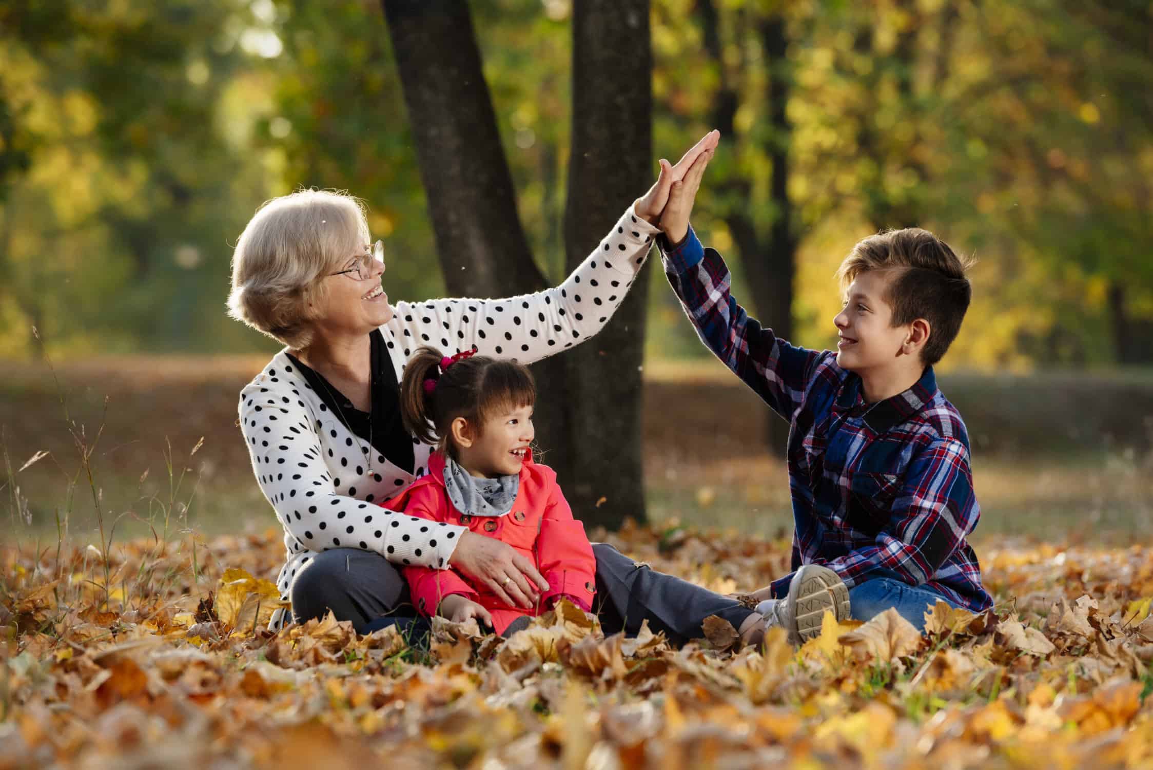 Grandmother enjoying family time outside after thanksgiving travel