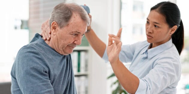 Physical therapist treating patient shoulder rotator cuff rehabilitation at Intecore Physical Therapy in Bremerton Washington
