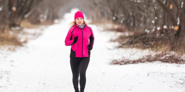 a woman running in the snow