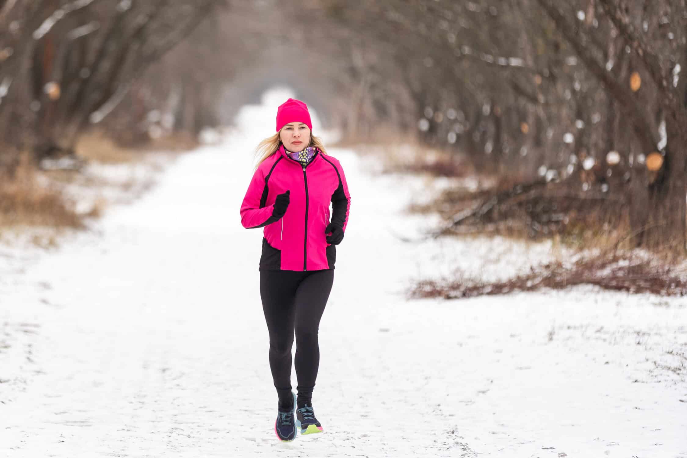 a woman running in the snow