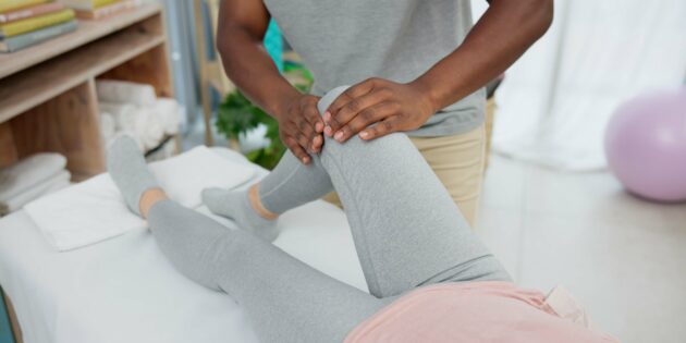 Physical therapist helping patient with knee replacement recovery exercises at Intecore Physical Therapy in Bremerton Washington