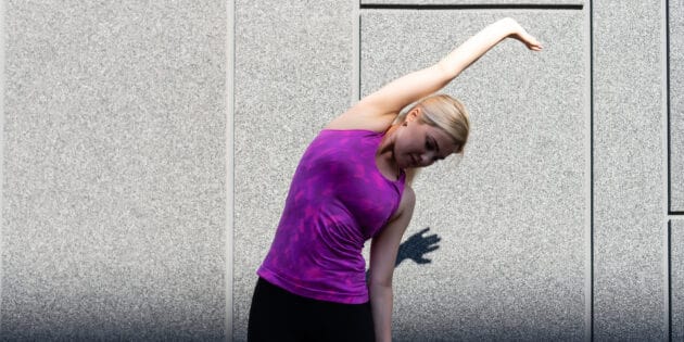 woman stretching to relieve back pain