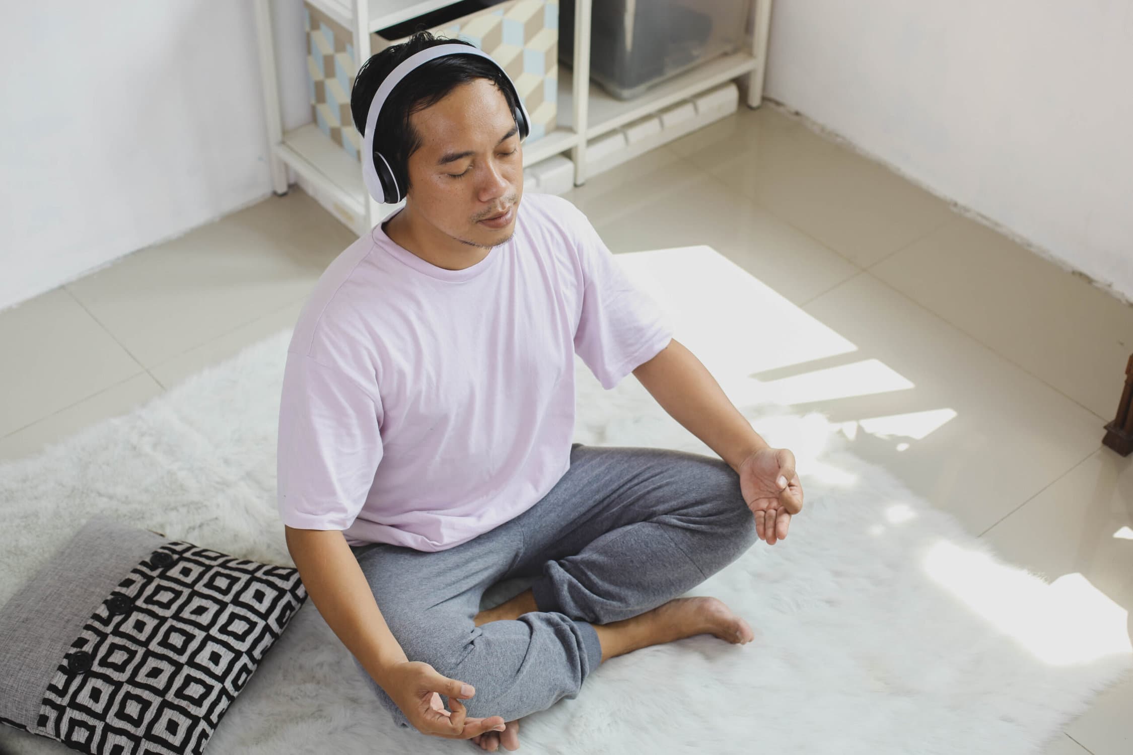 man incorporating healthy habits with meditation